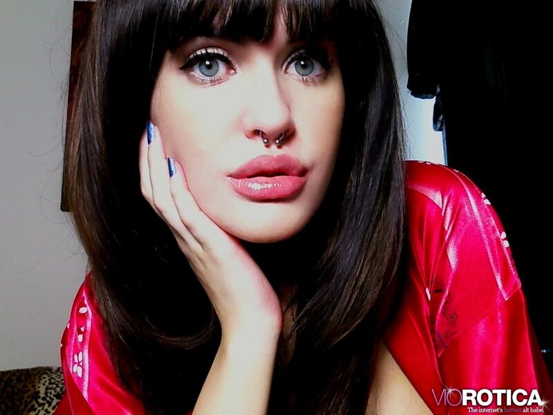 woman in red robe with nose ring