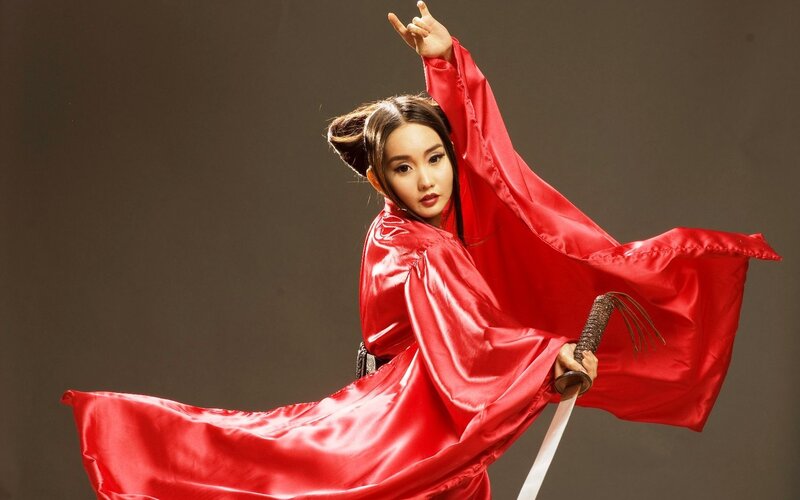 woman in red robe with sword