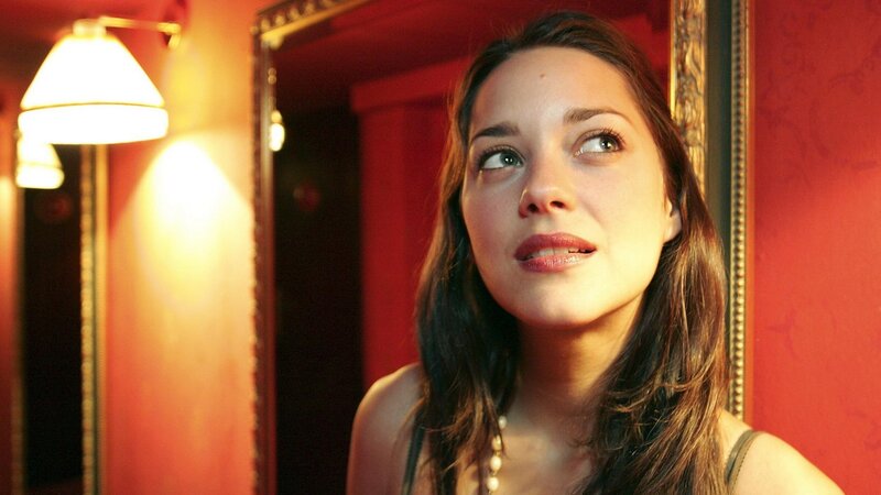 woman in red room looking up