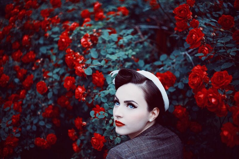 Woman in Red Rose Garden
