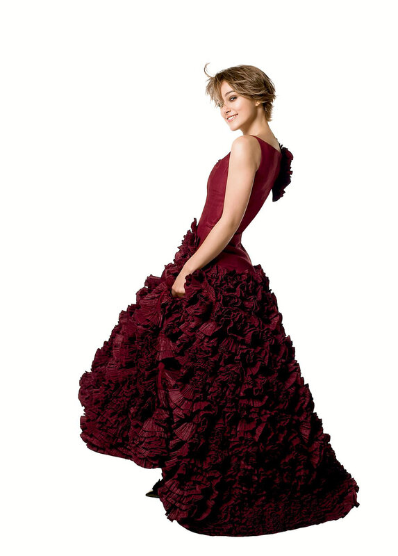 woman in red ruffled gown