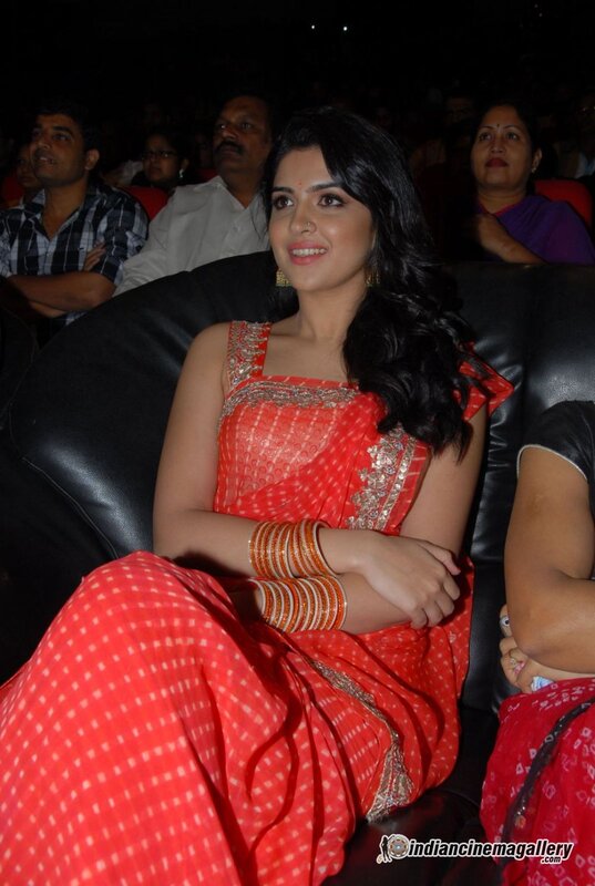 woman in red sari at event