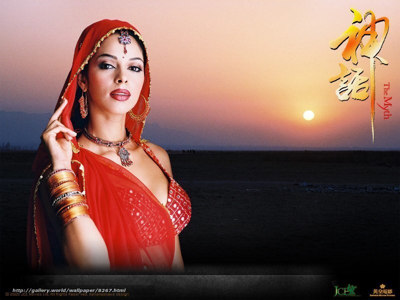 woman in red sari at sunset