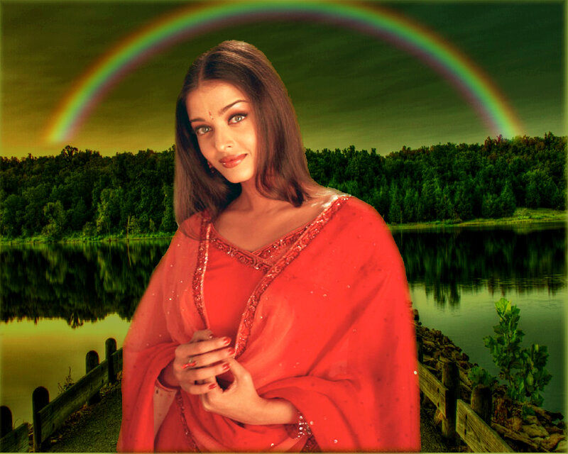 woman in red sari by lake