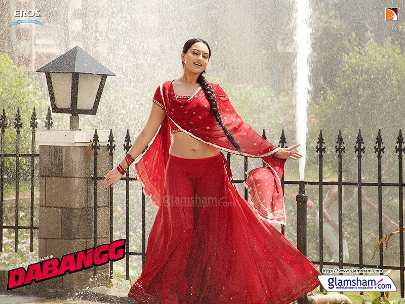 woman in red sari dancing