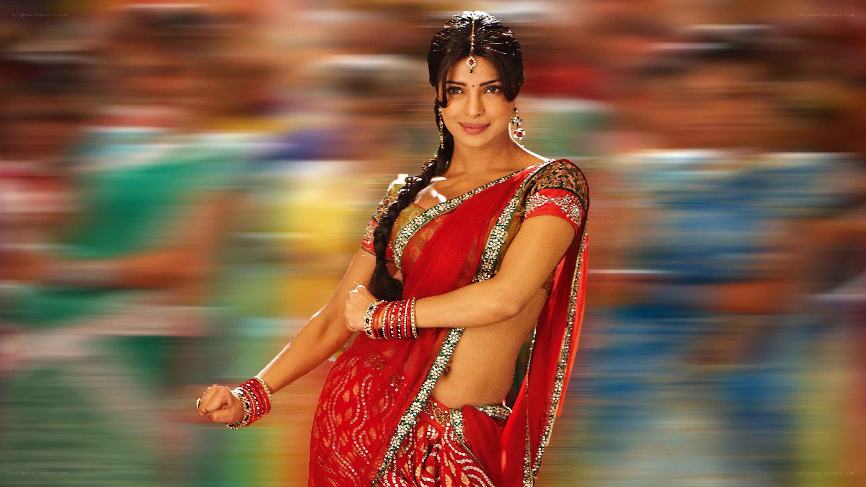 woman in red sari dancing