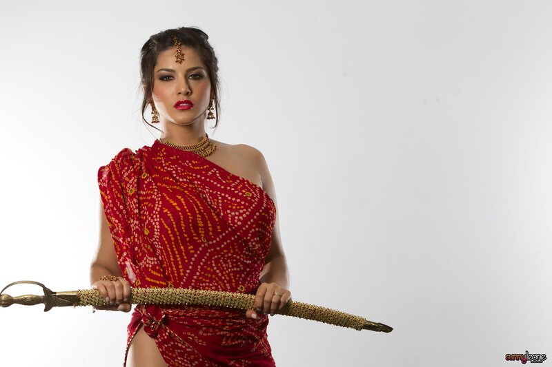 woman in red sari holding sword