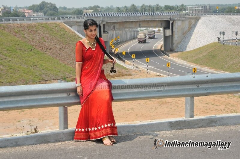 Woman in red sari on roadside