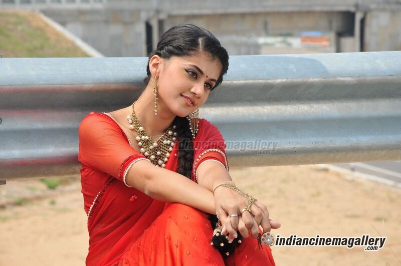 woman in red sari sitting