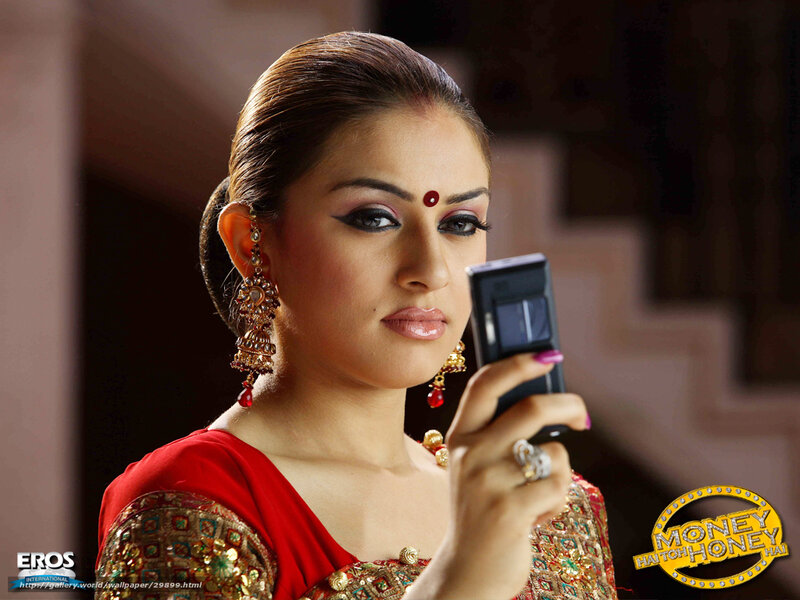 woman in red sari using phone