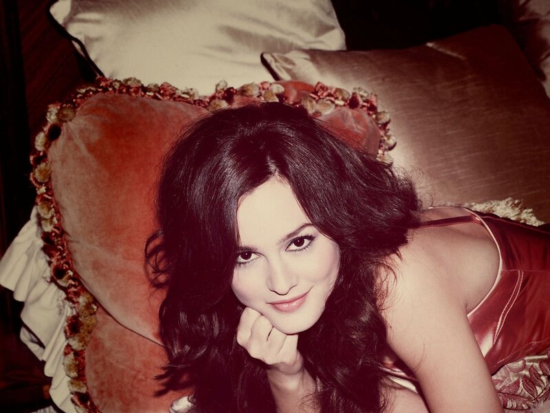woman in red satin lying on pillow