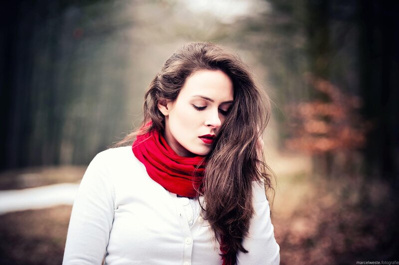 woman in red scarf outdoors