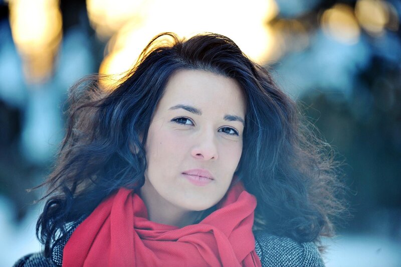 woman in red scarf outdoors
