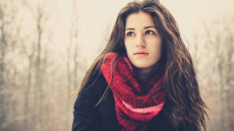 woman in red scarf outdoors