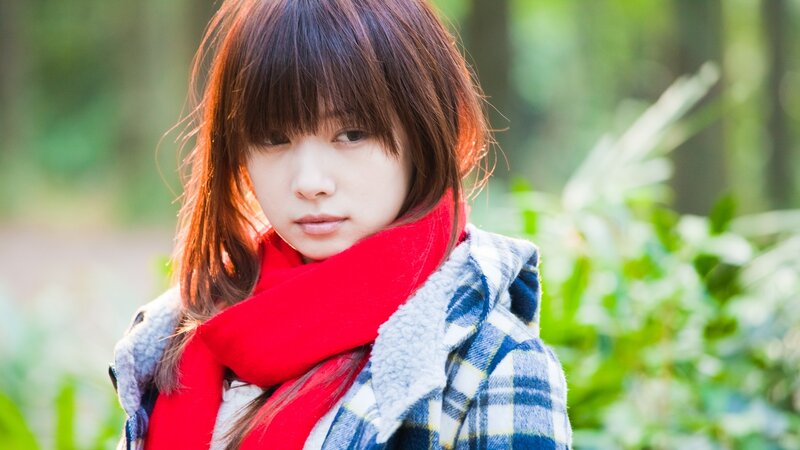 woman in red scarf outdoors