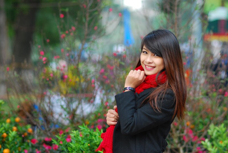 Woman in red scarf smiling