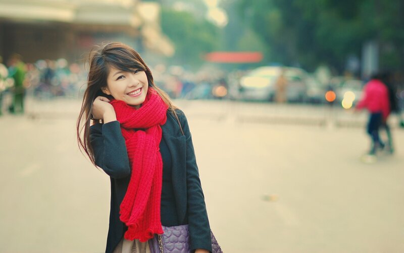 woman in red scarf smiling