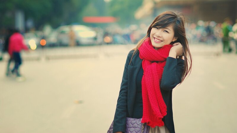 woman in red scarf smiling