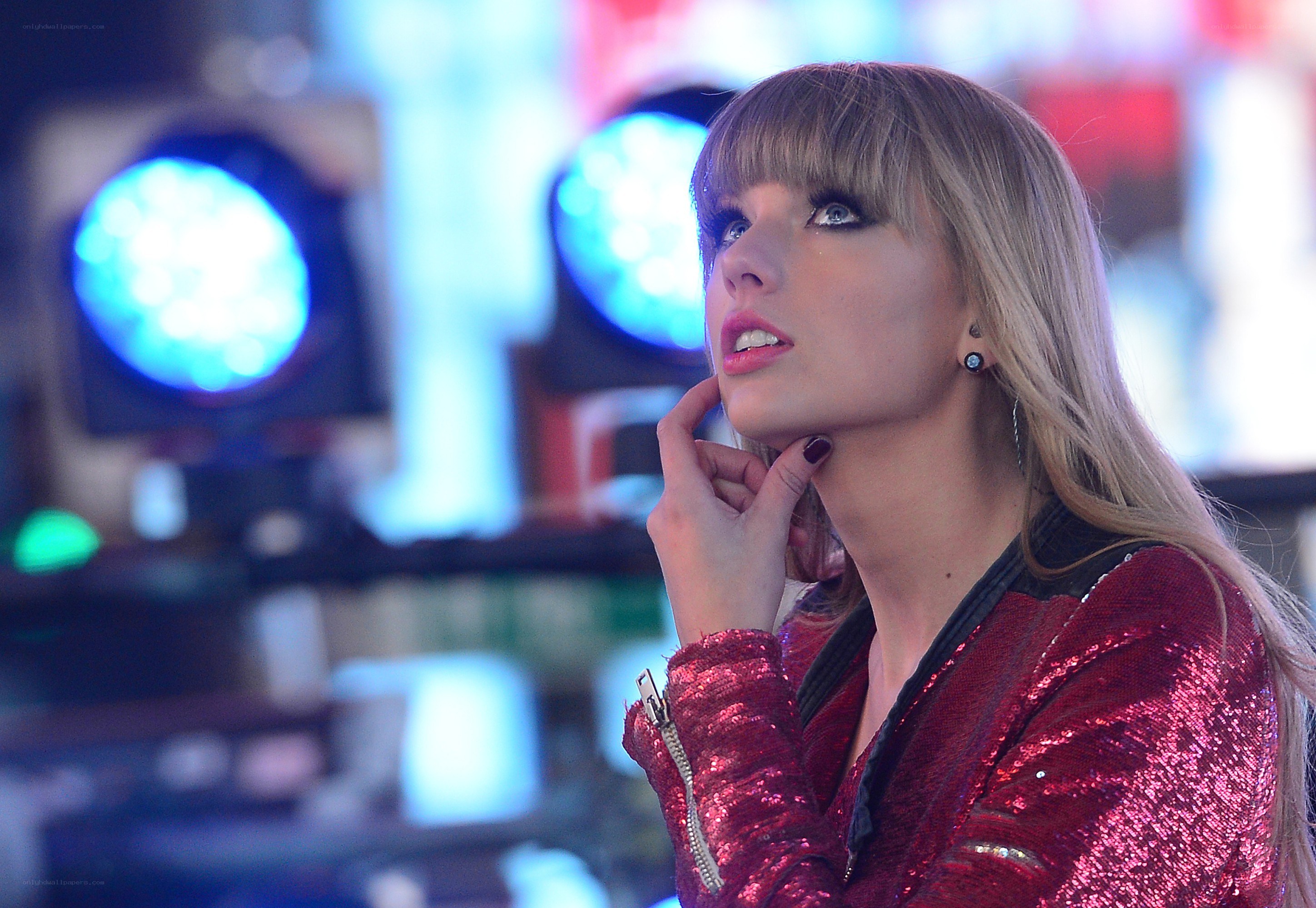 woman in red sequin jacket