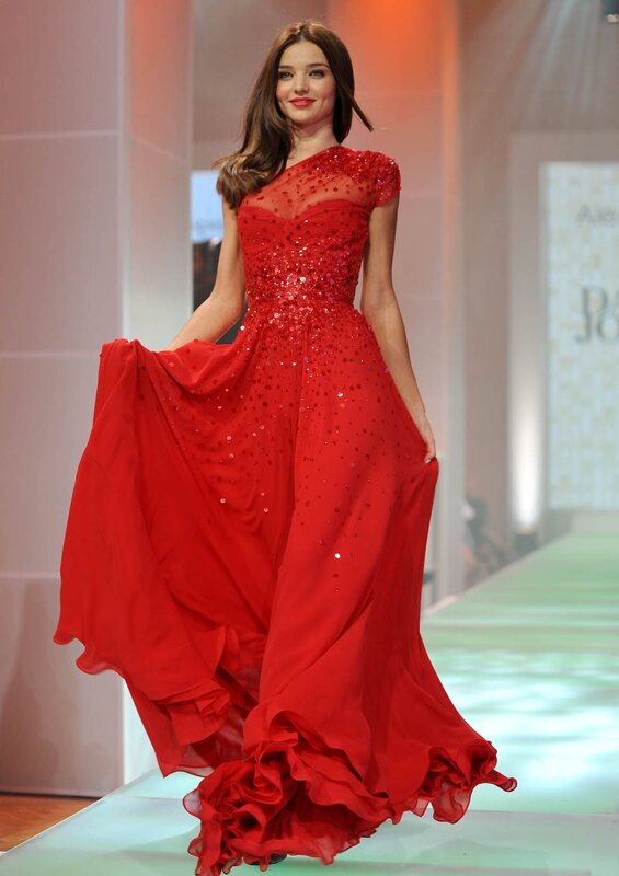 Woman in red sequined gown