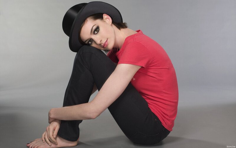 woman in red shirt and hat