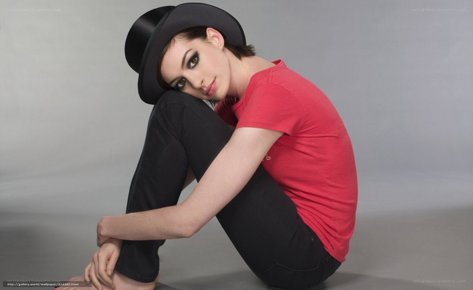 woman in red shirt and hat