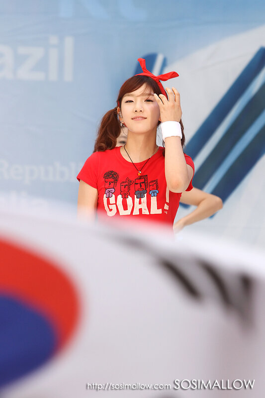 woman in red shirt at event