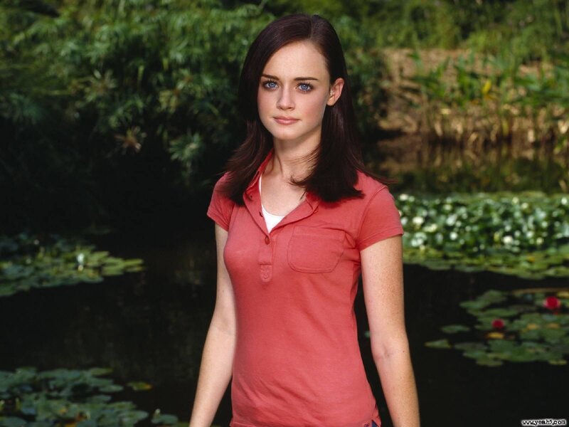 woman in red shirt by pond