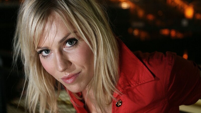 woman in red shirt looking at camera