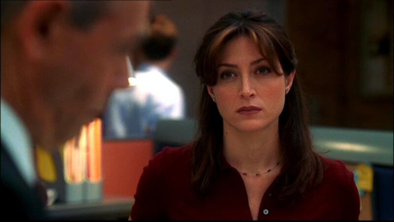 woman in red shirt looking at man