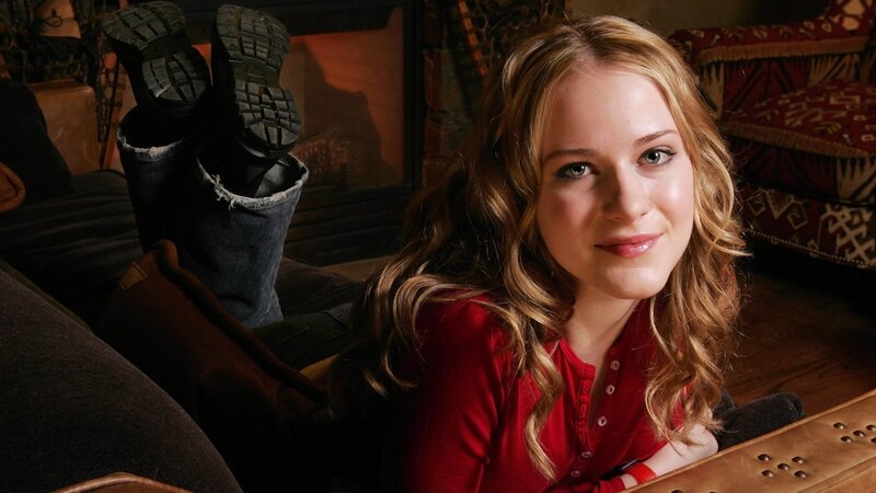 woman in red shirt on couch