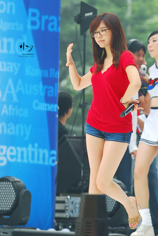 woman in red shirt performing
