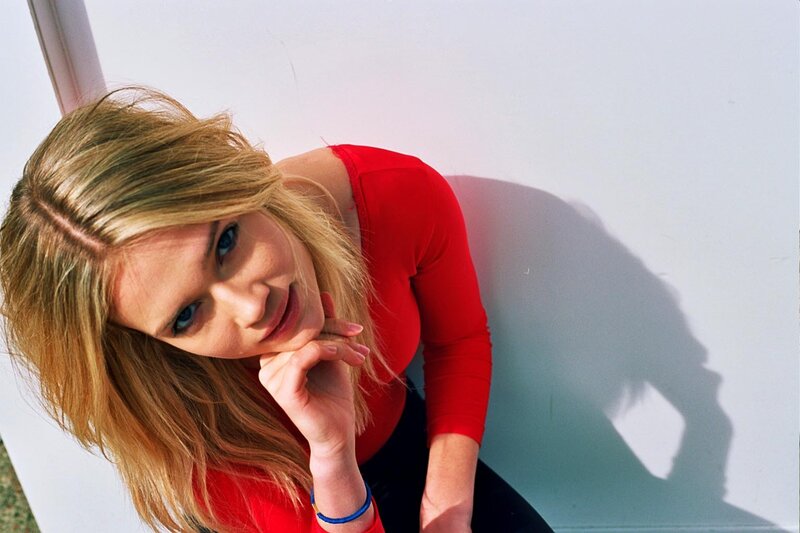 woman in red shirt posing
