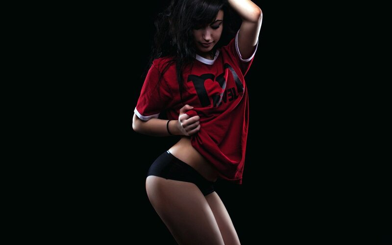 woman in red shirt posing