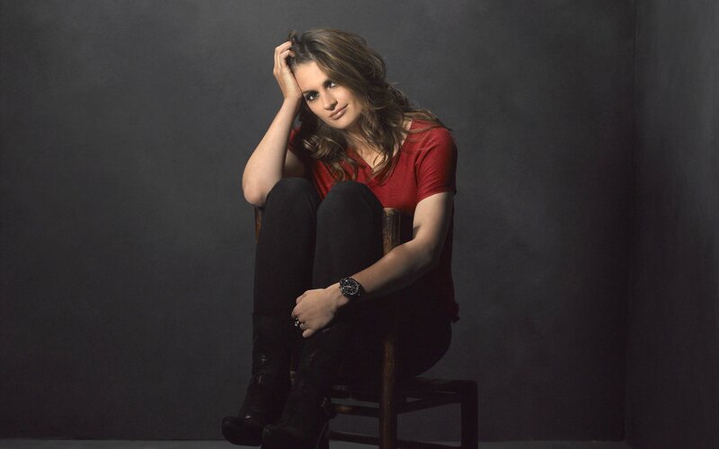 woman in red shirt sitting on chair