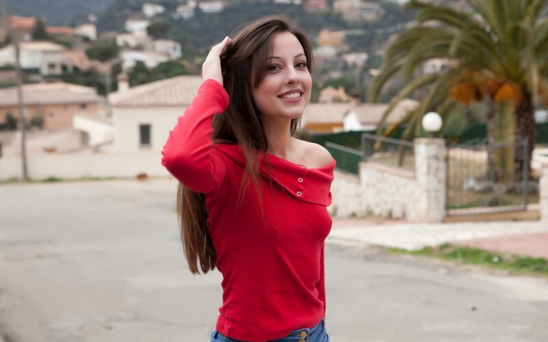 woman in red shirt smiling