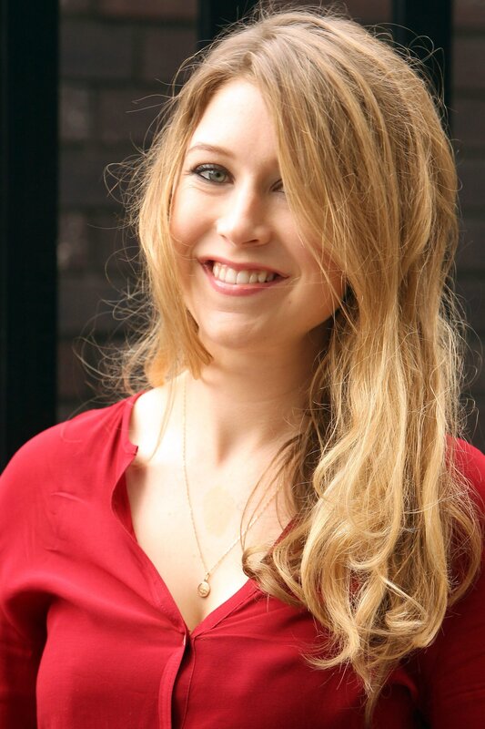 woman in red shirt smiling