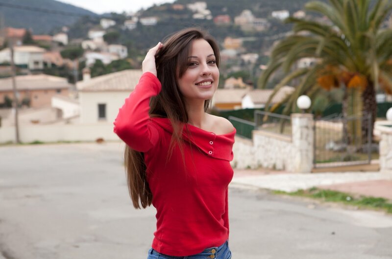 woman in red shirt smiling