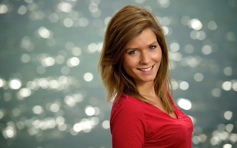woman in red shirt smiling