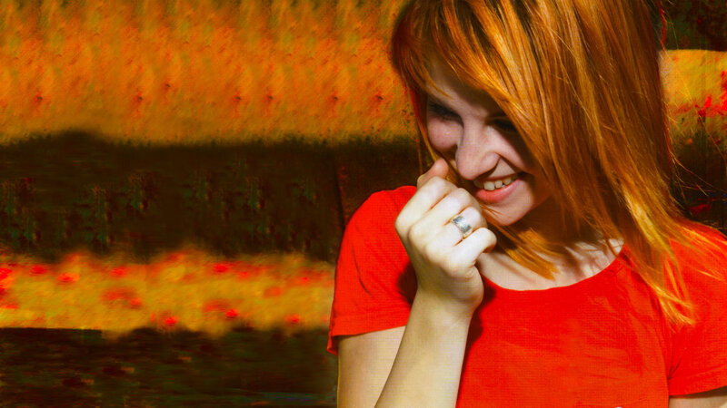 woman in red shirt smiling
