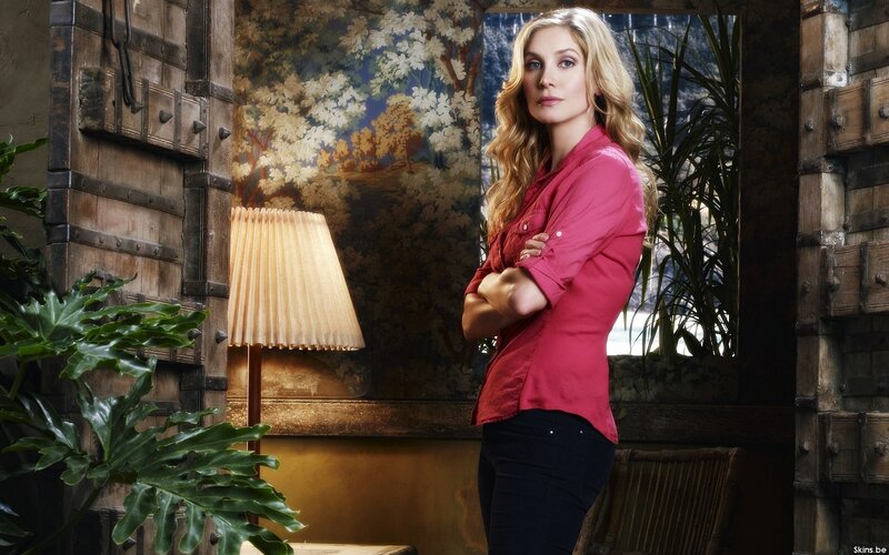 woman in red shirt standing