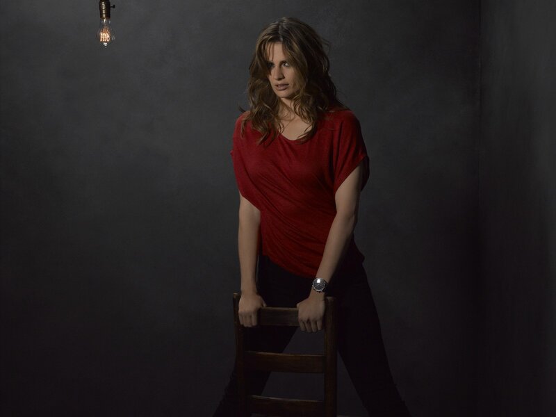 woman in red shirt standing
