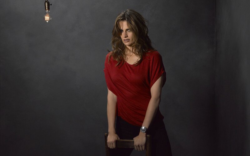 woman in red shirt standing