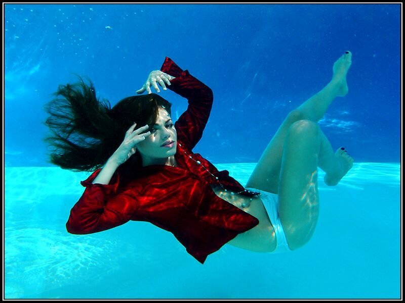 Woman in Red Shirt Underwater