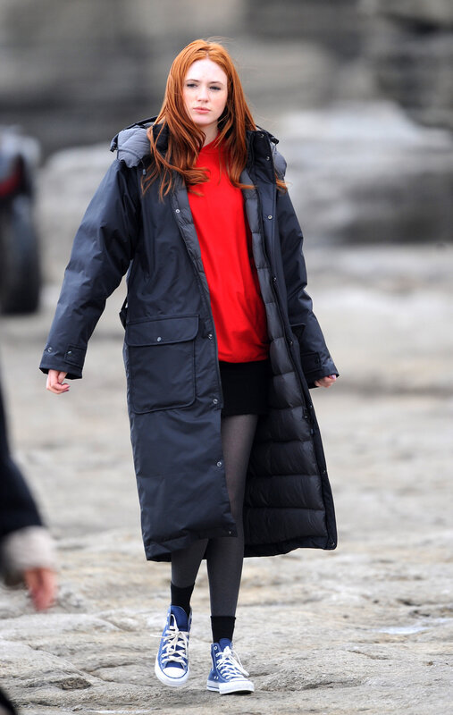 Woman in red shirt walking