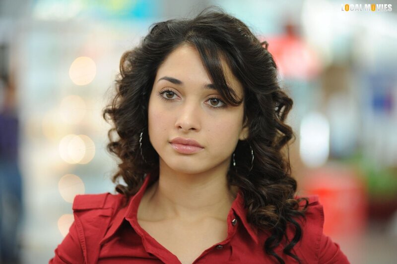 woman in red shirt with curly hair