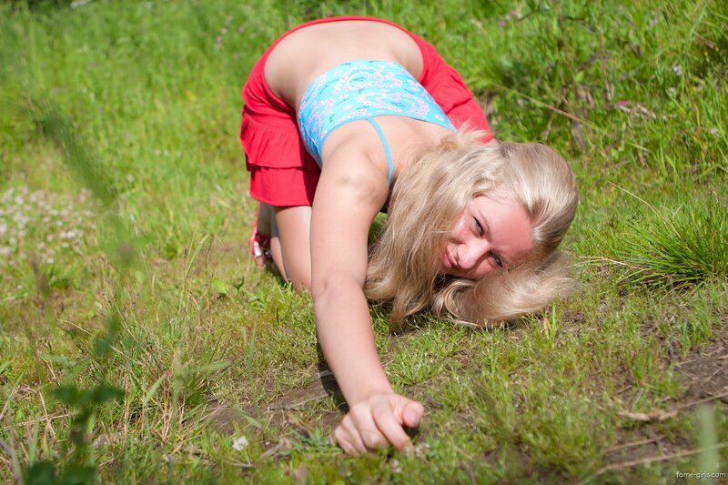 woman in red shorts on grass