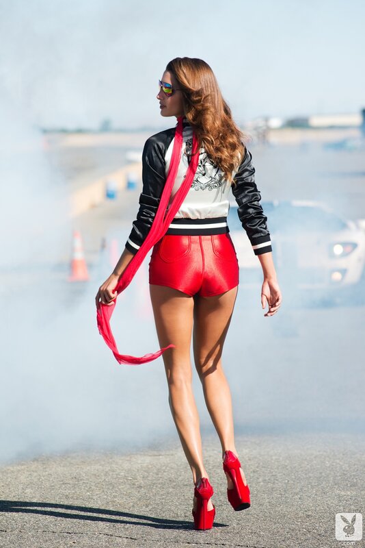 Woman in red shorts on racetrack