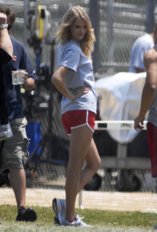 woman in red shorts on set