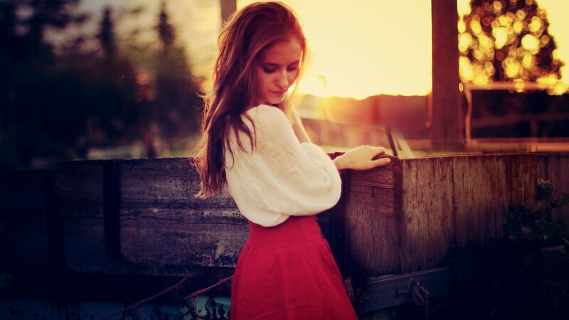 woman in red skirt at sunset
